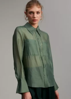 Blusa bolsillos transparencia