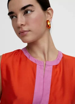 Top bicolor con aberturas