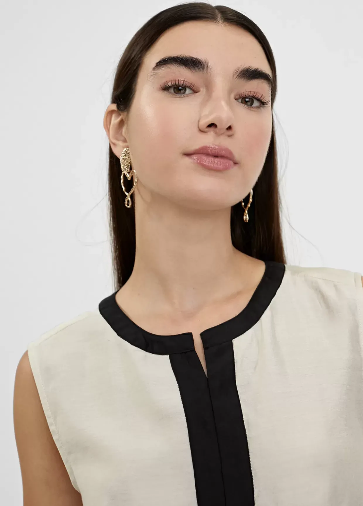 Top bicolor con aberturas