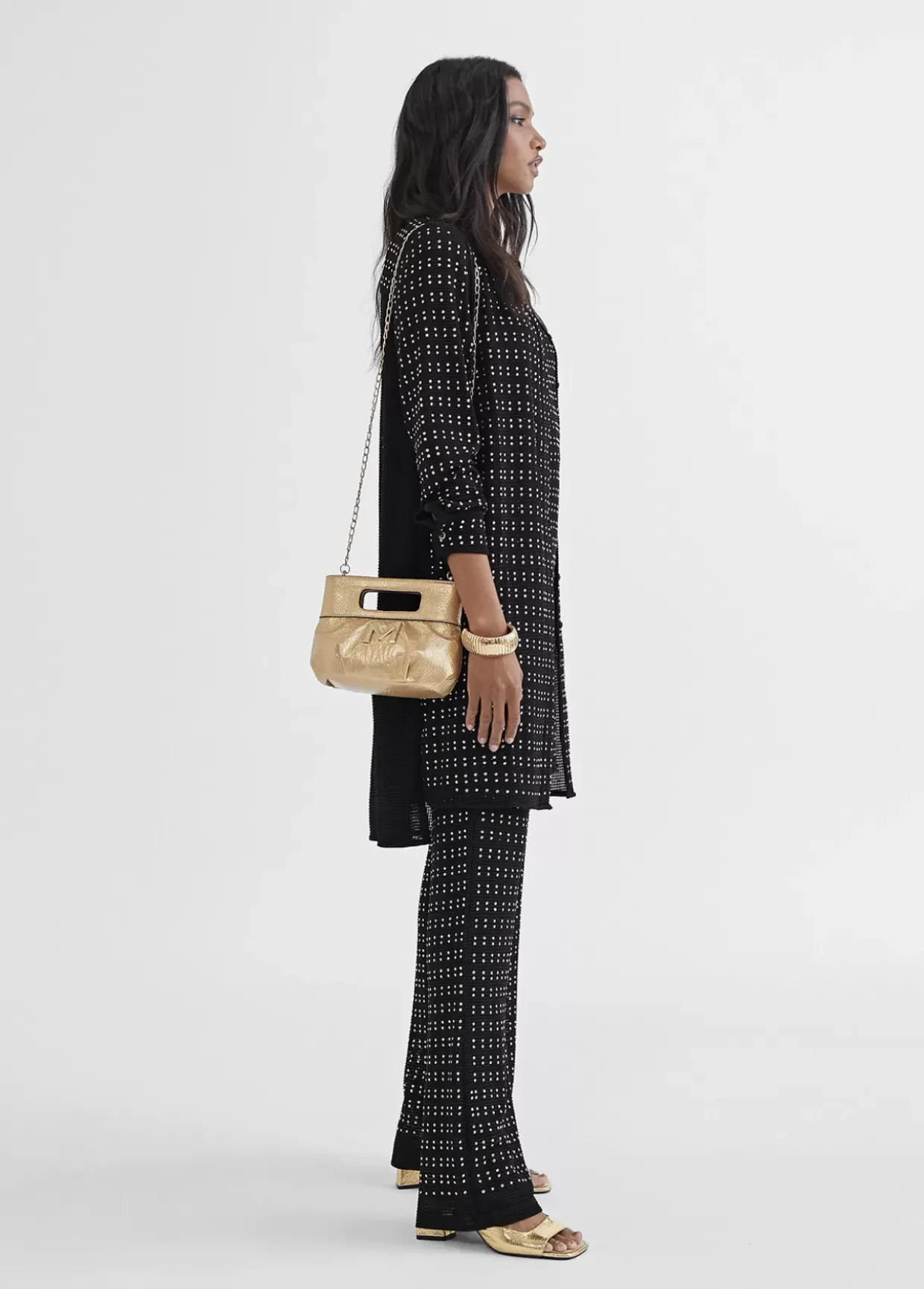 Top largo con piezas metalicas