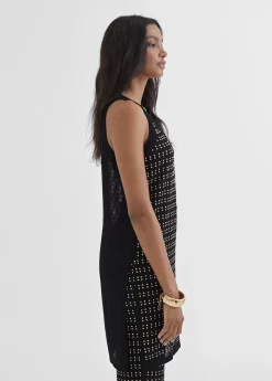 Top largo con piezas metalicas